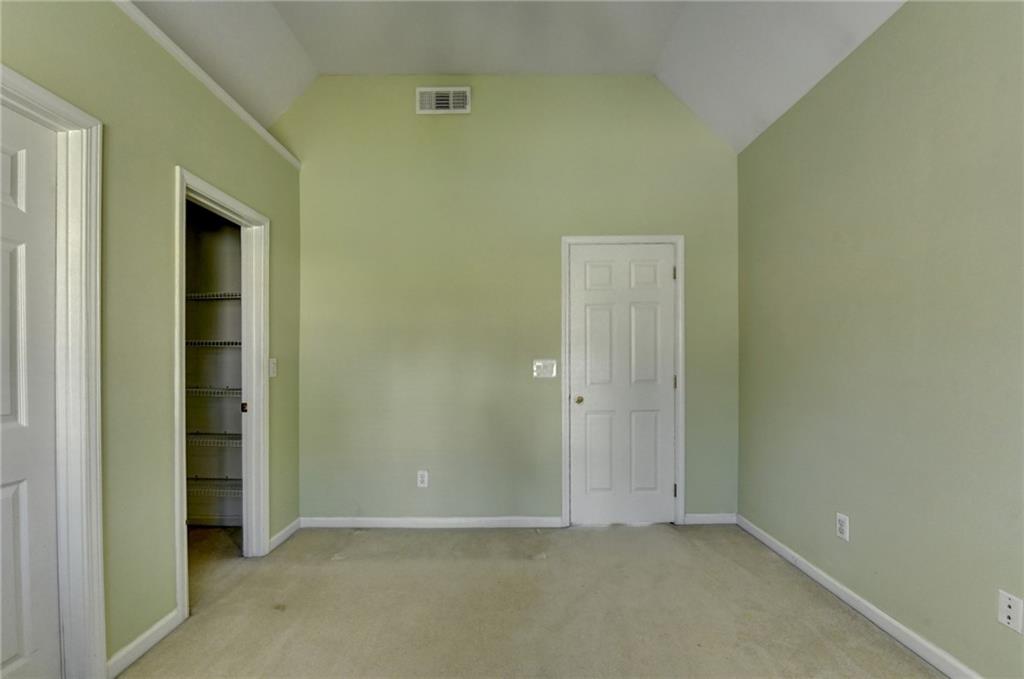 2152 Merrymount Drive Suwanee, GA 30024 - Photo 31 of 63 an empty room that has a grey walls