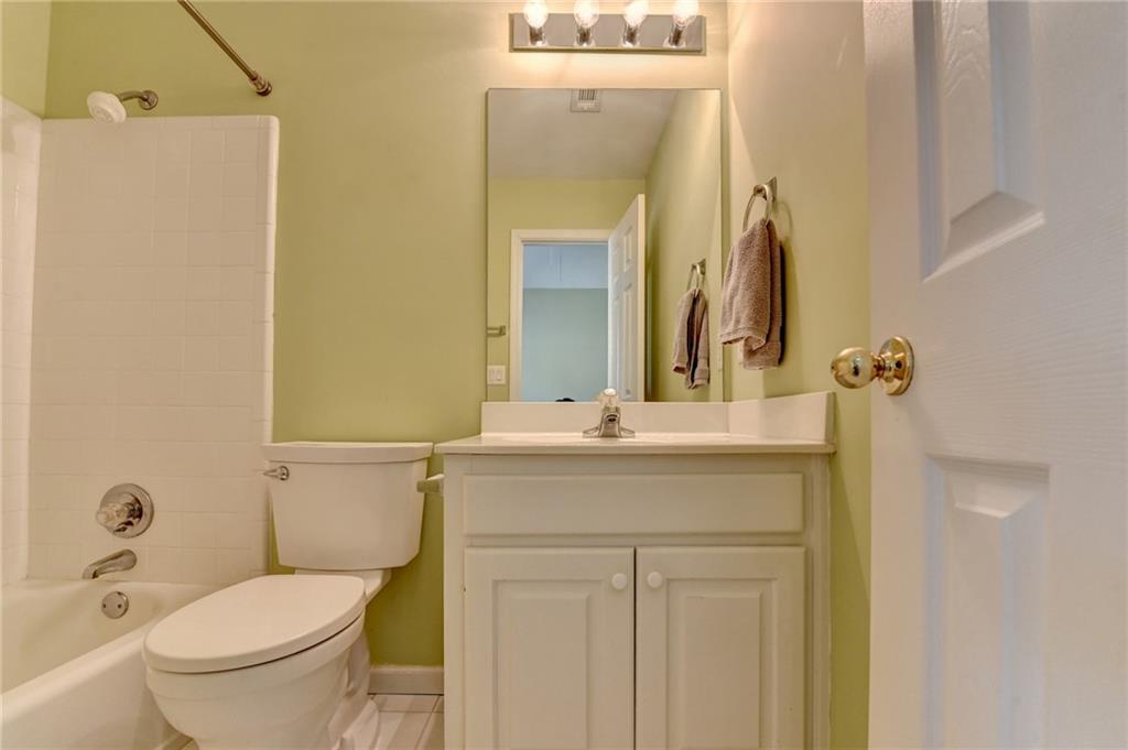 2152 Merrymount Drive Suwanee, GA 30024 - Photo 32 of 63 a bathroom with a toilet sink and mirror