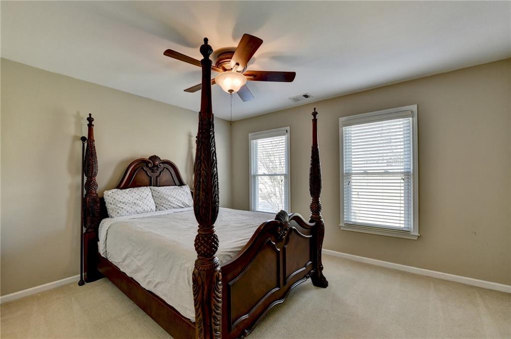 2152 Merrymount Drive Suwanee, GA 30024 - Photo 33 of 63 a bedroom with a bed and a window