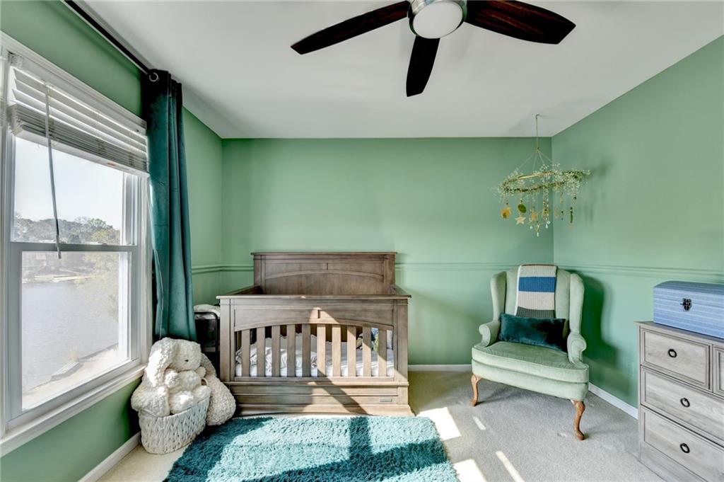 2152 Merrymount Drive Suwanee, GA 30024 - Photo 36 of 63 a bedroom with furniture and a window