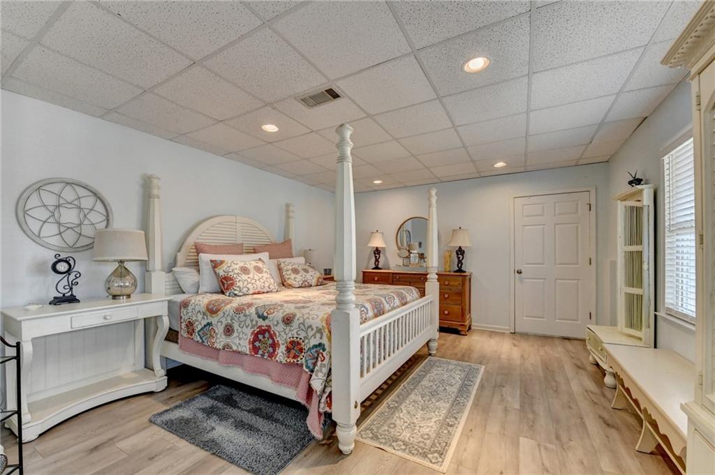 2152 Merrymount Drive Suwanee, GA 30024 - Photo 39 of 63 a bedroom with a bed and a chandelier