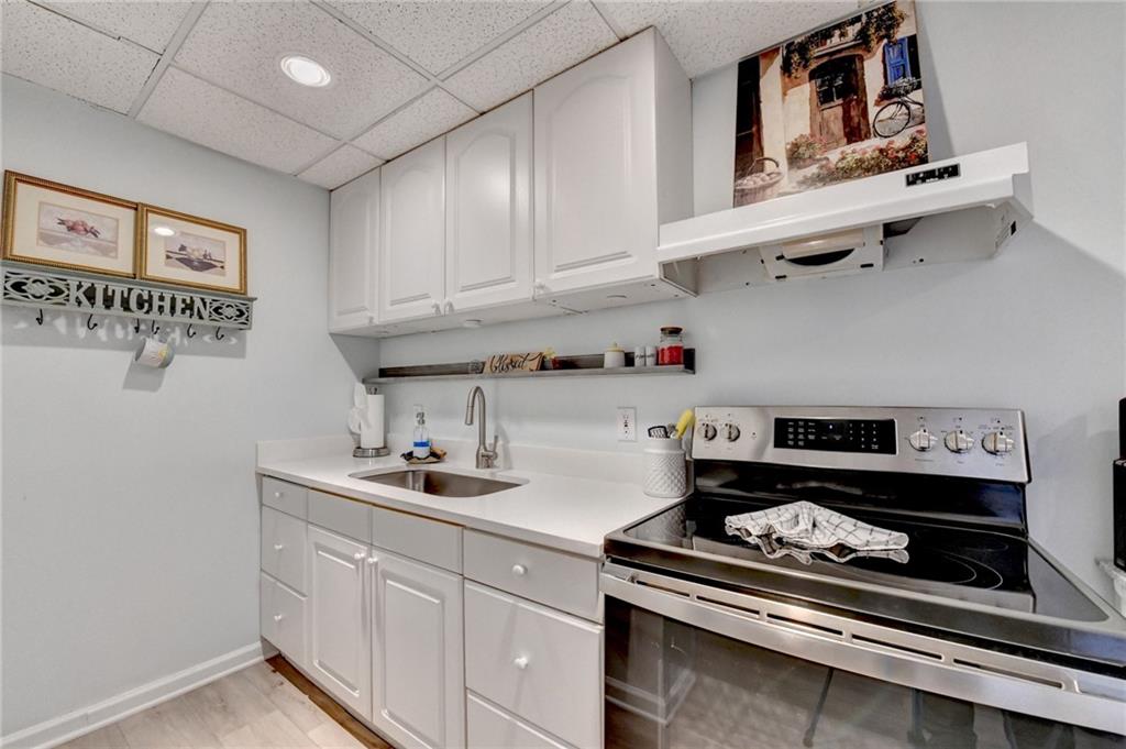 2152 Merrymount Drive Suwanee, GA 30024 - Photo 43 of 63 a kitchen with appliances cabinets and a window