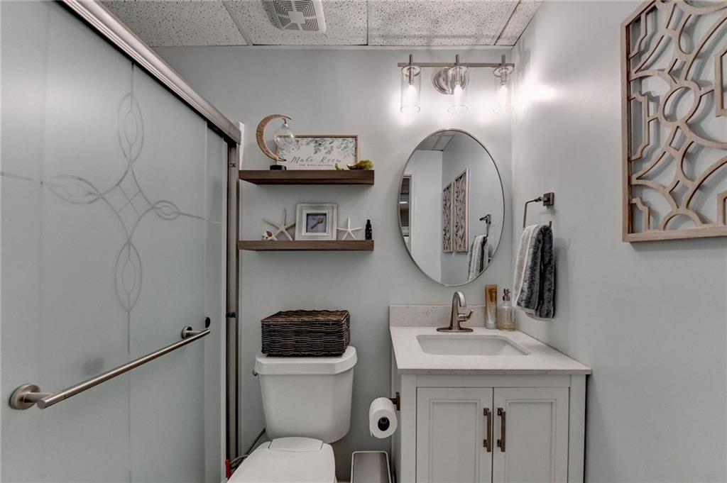 2152 Merrymount Drive Suwanee, GA 30024 - Photo 44 of 63 a bathroom with a toilet sink and mirror