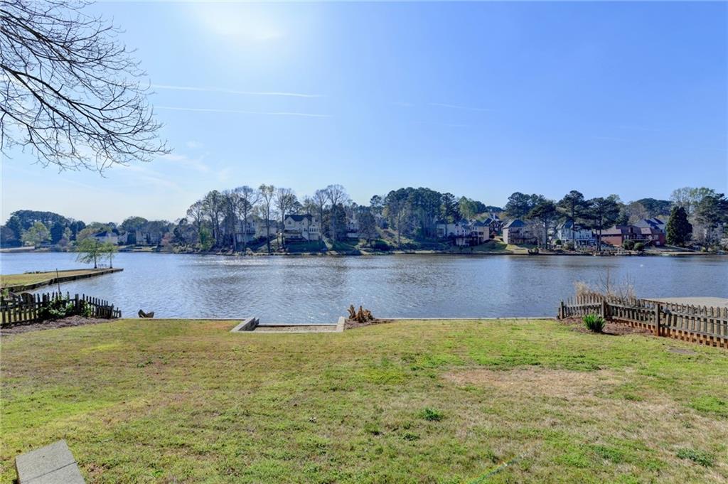 2152 Merrymount Drive Suwanee, GA 30024 - Photo 47 of 63 a view of a lake with houses in the back