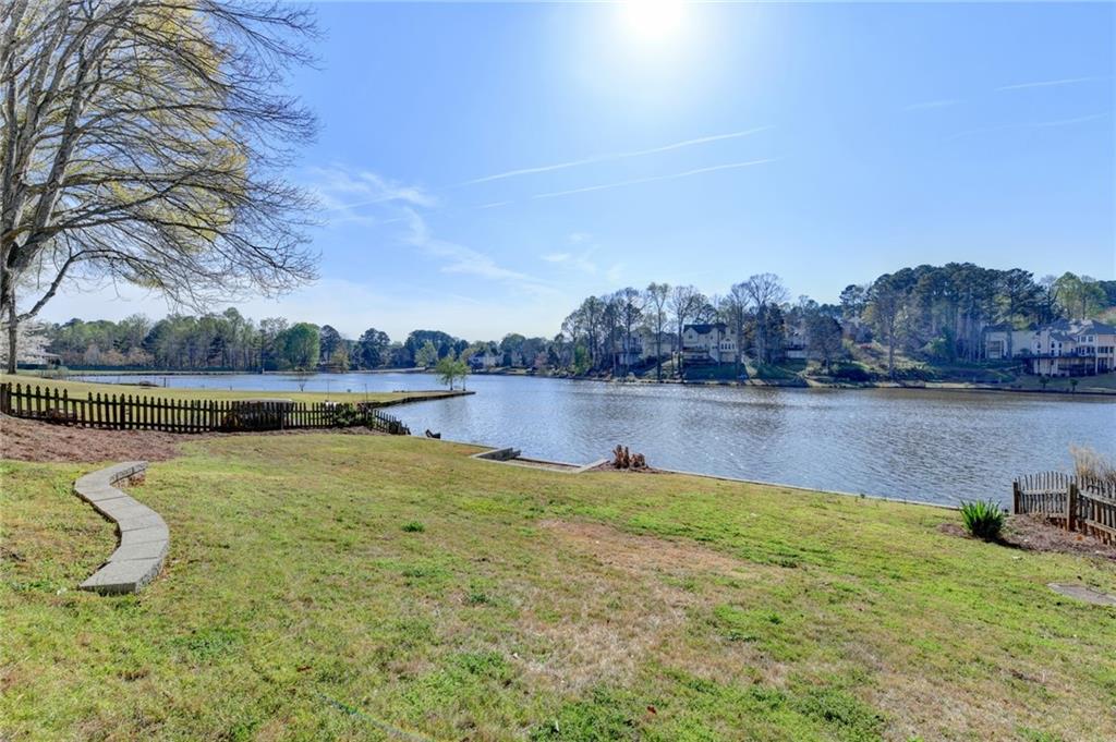 2152 Merrymount Drive Suwanee, GA 30024 - Photo 48 of 63 a view of a lake with houses in the back