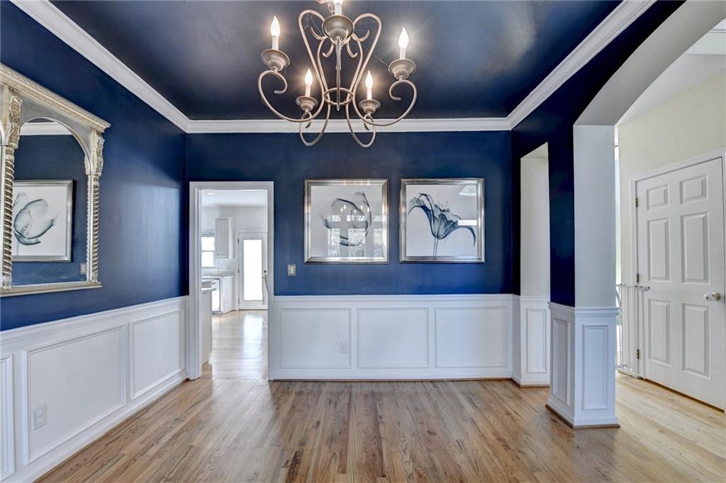 2152 Merrymount Drive Suwanee, GA 30024 - Photo 5 of 63 a view of a hallway with wooden floor and front door