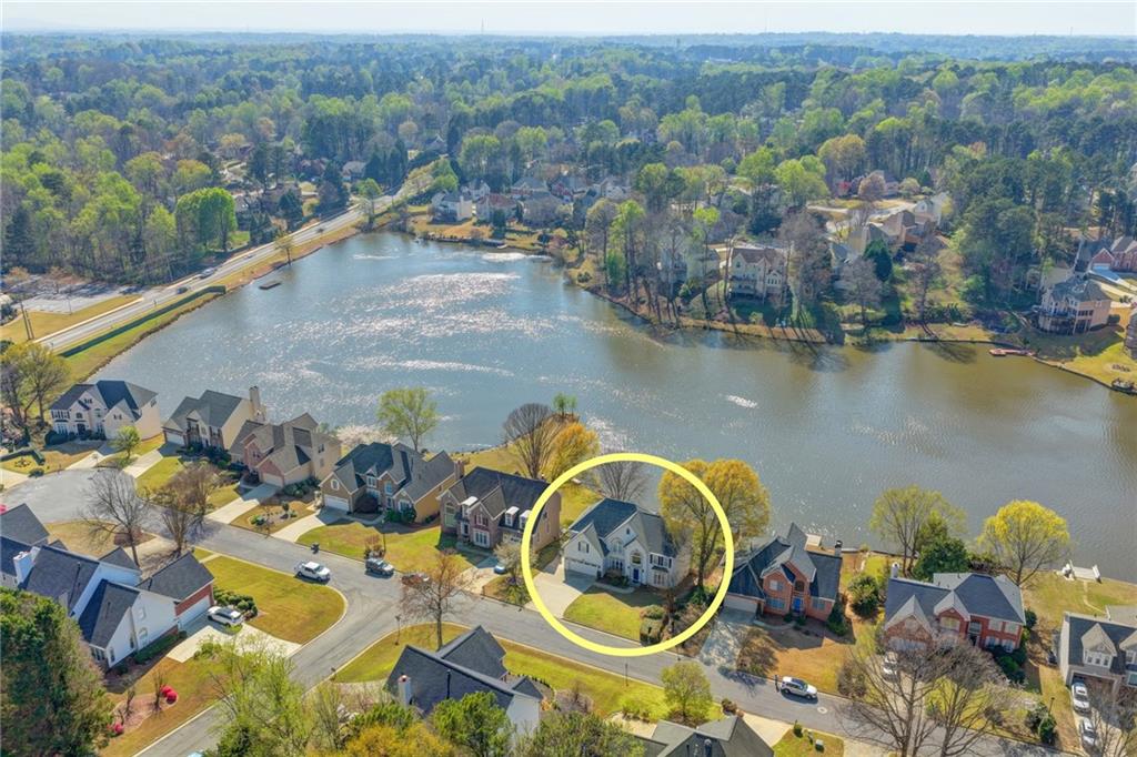 2152 Merrymount Drive Suwanee, GA 30024 - Photo 56 of 63 an aerial view of lake residential house with outdoor space and swimming pool