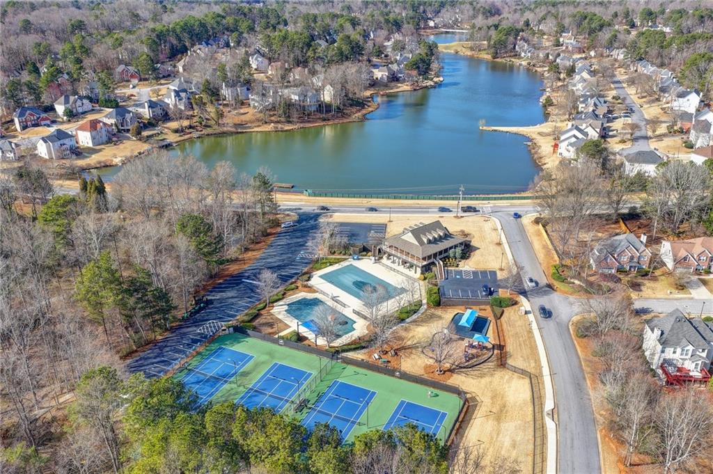 2152 Merrymount Drive Suwanee, GA 30024 - Photo 62 of 63 an aerial view of a house with a lake view