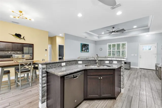 a kitchen with lots of counter space and sink