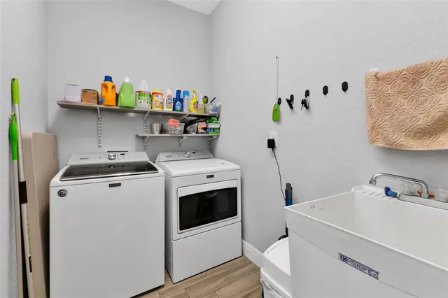 a utility room with dryer and washer