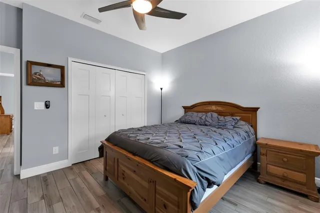 a bedroom with a bed and a dresser