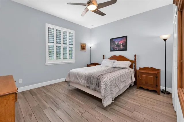 a bedroom with a bed dresser and a window