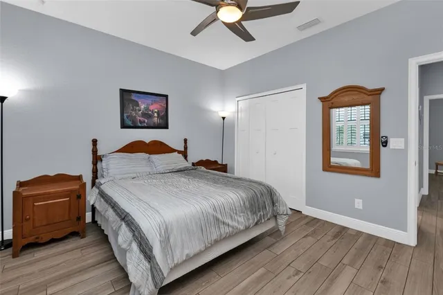 a bedroom with bed and window