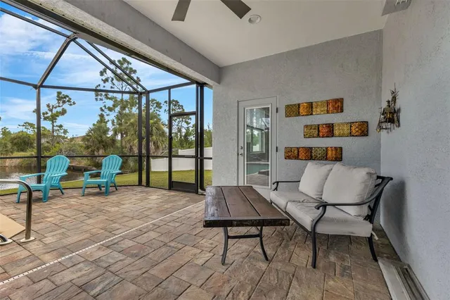 a reading room with furniture and a floor to ceiling window