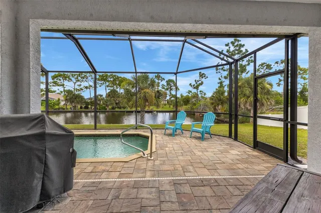 an outdoor sitting area with couch and table in the patio