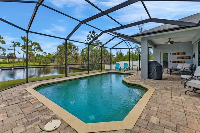 a view of a swimming pool with a patio