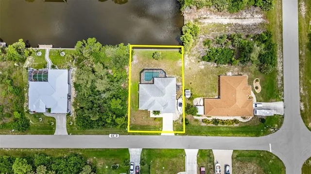 an aerial view of a house with swimming pool