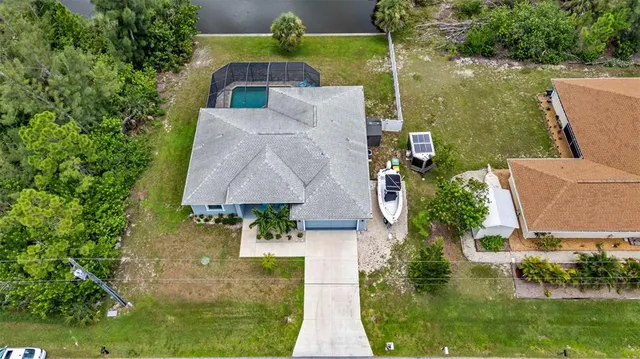 an aerial view of house with yard