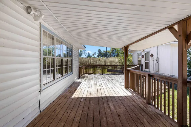a view of balcony with wooden floor