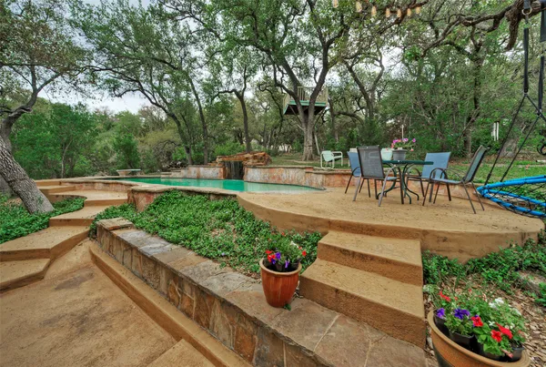 a view of a backyard with sitting area