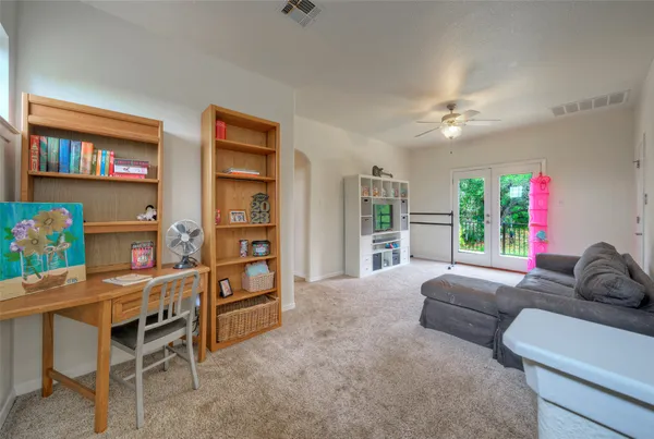 a living room with furniture and a window