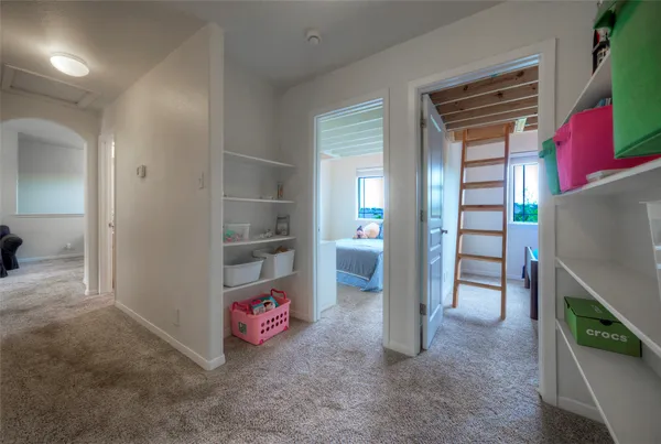 an entryway and livingroom with furniture