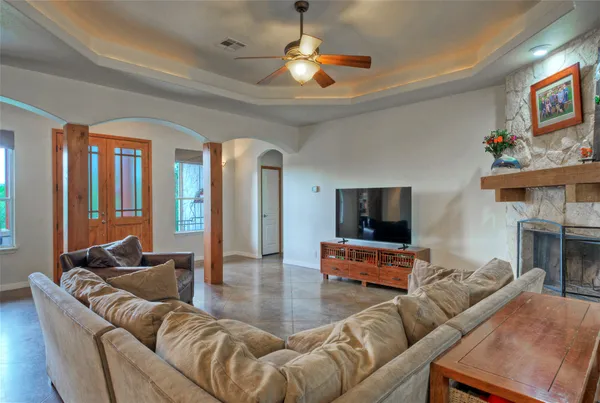 a living room with furniture and a flat screen tv