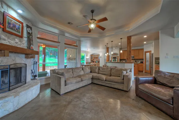 a living room with furniture and a fireplace