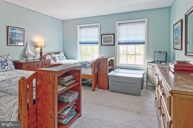 a bed room with a bed and a window