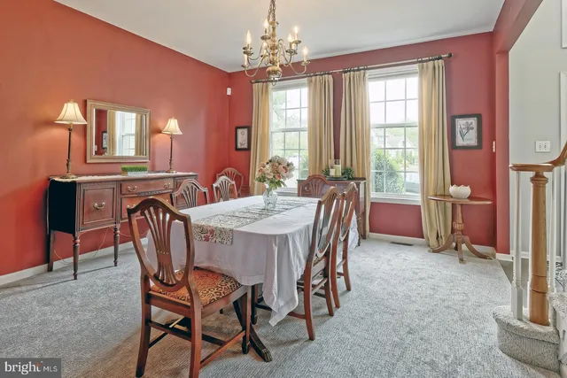 a view of a dining room with furniture and window