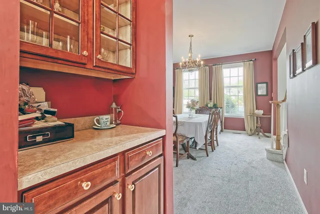 a kitchen with stainless steel appliances granite countertop a sink dishwasher and cabinets with wooden floor
