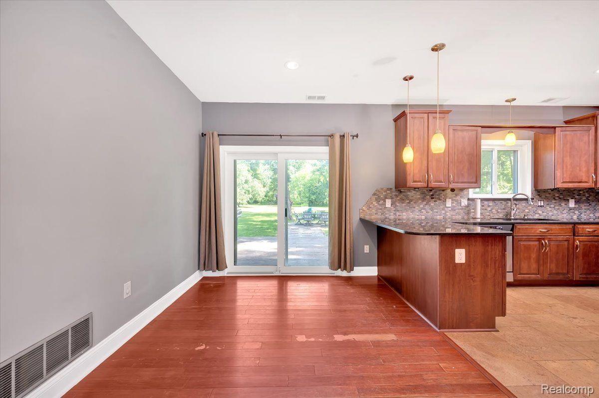 2930 Clarkston Road Lake Orion, MI 48362 - Photo 12 of 26 Dining Room with Door Wall leading to Back Deck.
