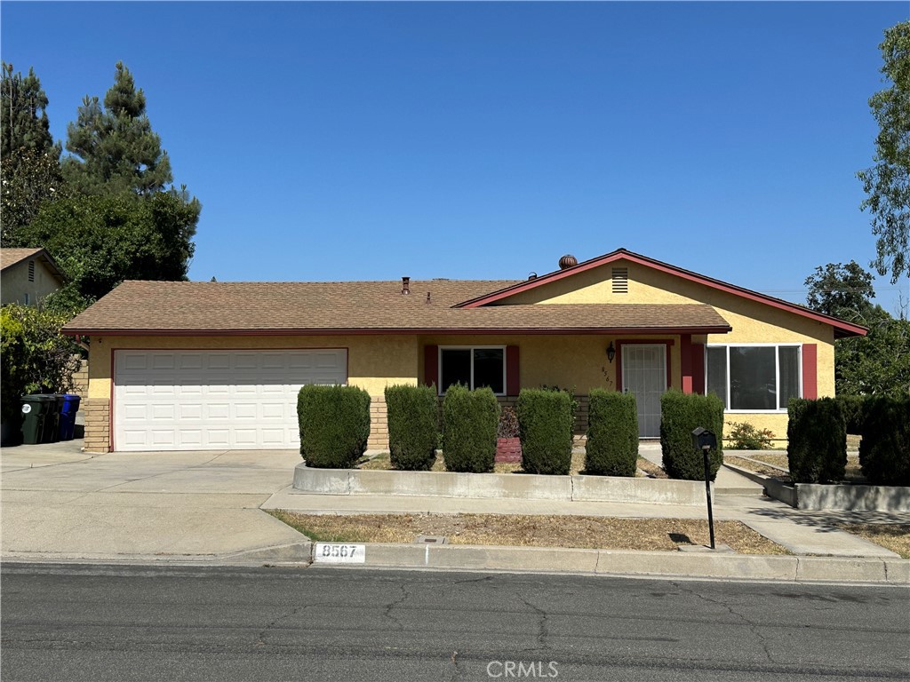 8567 Jasper Street Rancho Cucamonga, CA 91730 - Photo 1 of 1 a front view of a house with a yard