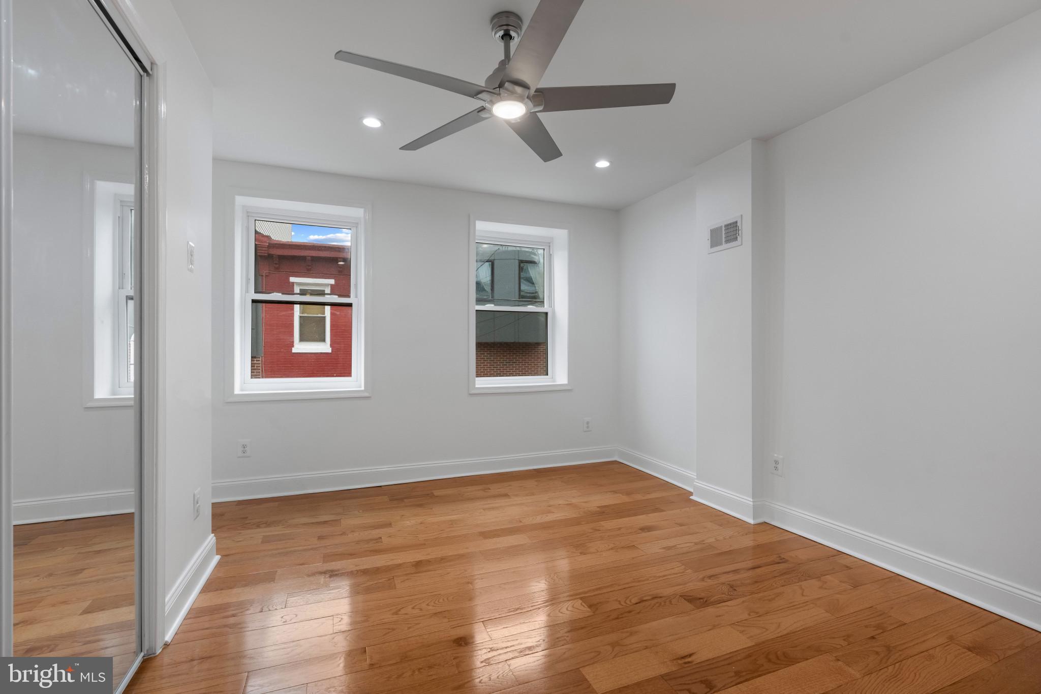 625 Winton Street Philadelphia, PA 19148 - Photo 15 of 25 a view of empty room with wooden floor and fan
