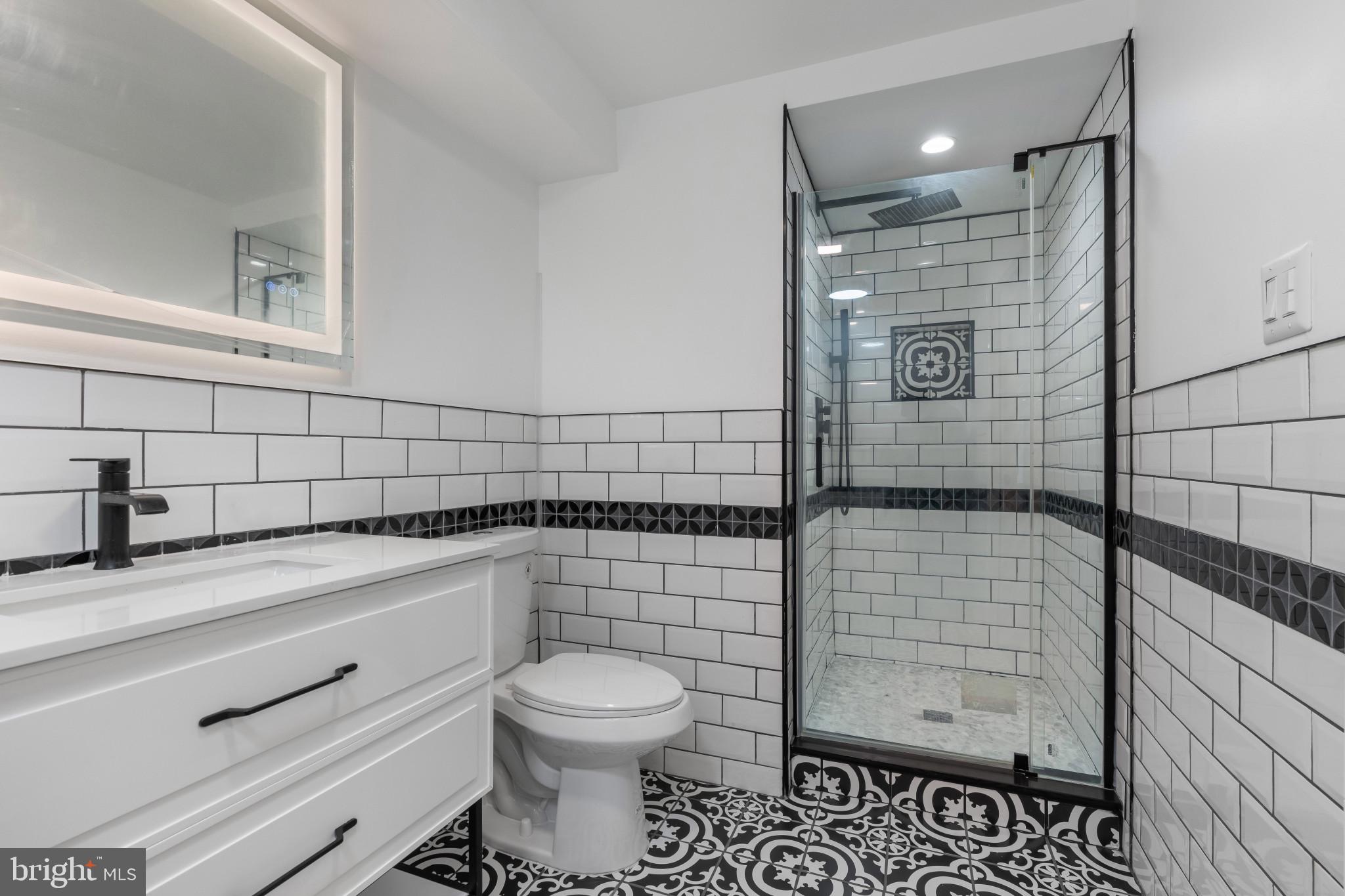 625 Winton Street Philadelphia, PA 19148 - Photo 19 of 25 a bathroom with a toilet sink and shower