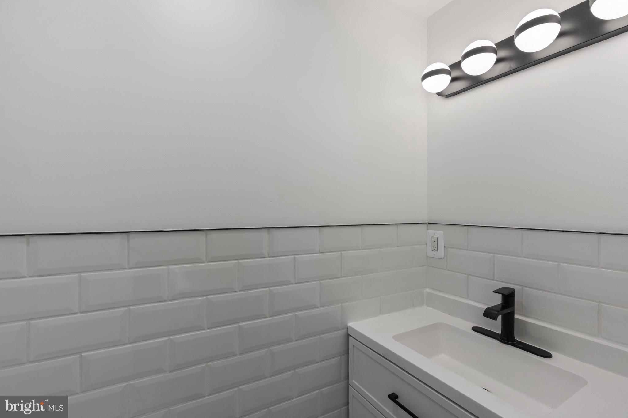 625 Winton Street Philadelphia, PA 19148 - Photo 8 of 25 a bathroom with a sink and vanity