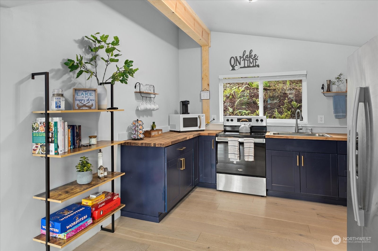 1024 South Lake Roesiger Road Snohomish, WA 98290 - Photo 13 of 35 a kitchen with stainless steel appliances granite countertop a stove a sink and a refrigerator