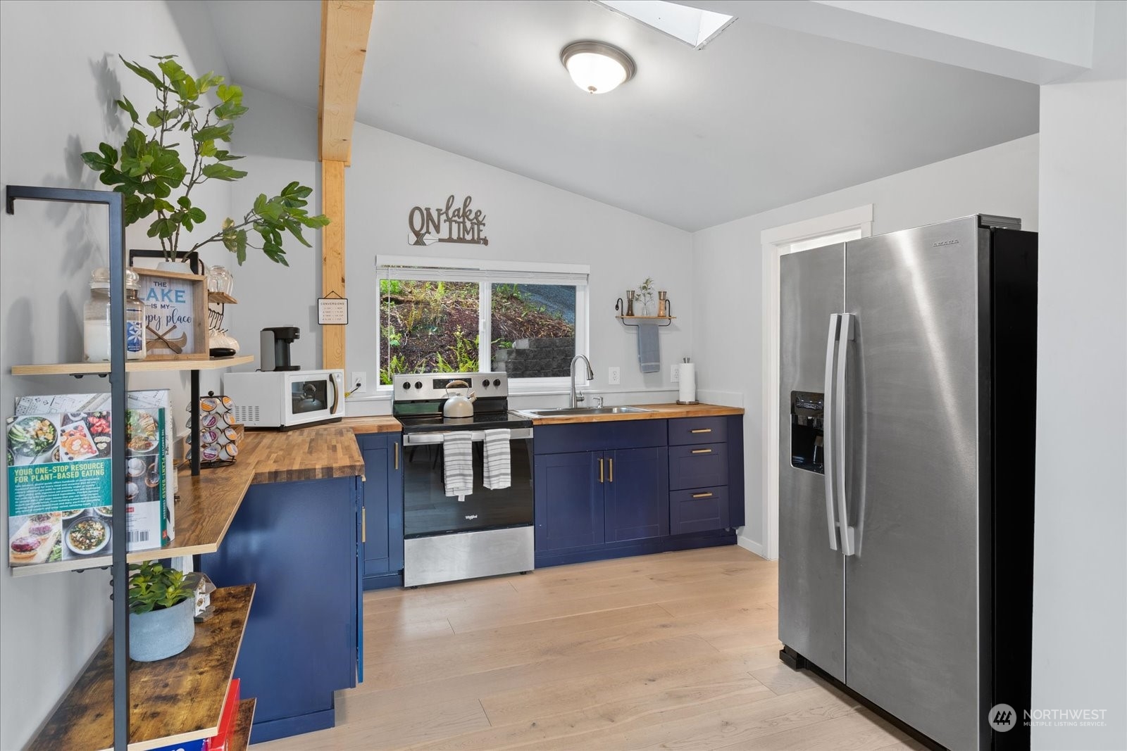 1024 South Lake Roesiger Road Snohomish, WA 98290 - Photo 14 of 35 a kitchen with stainless steel appliances granite countertop a refrigerator and a sink