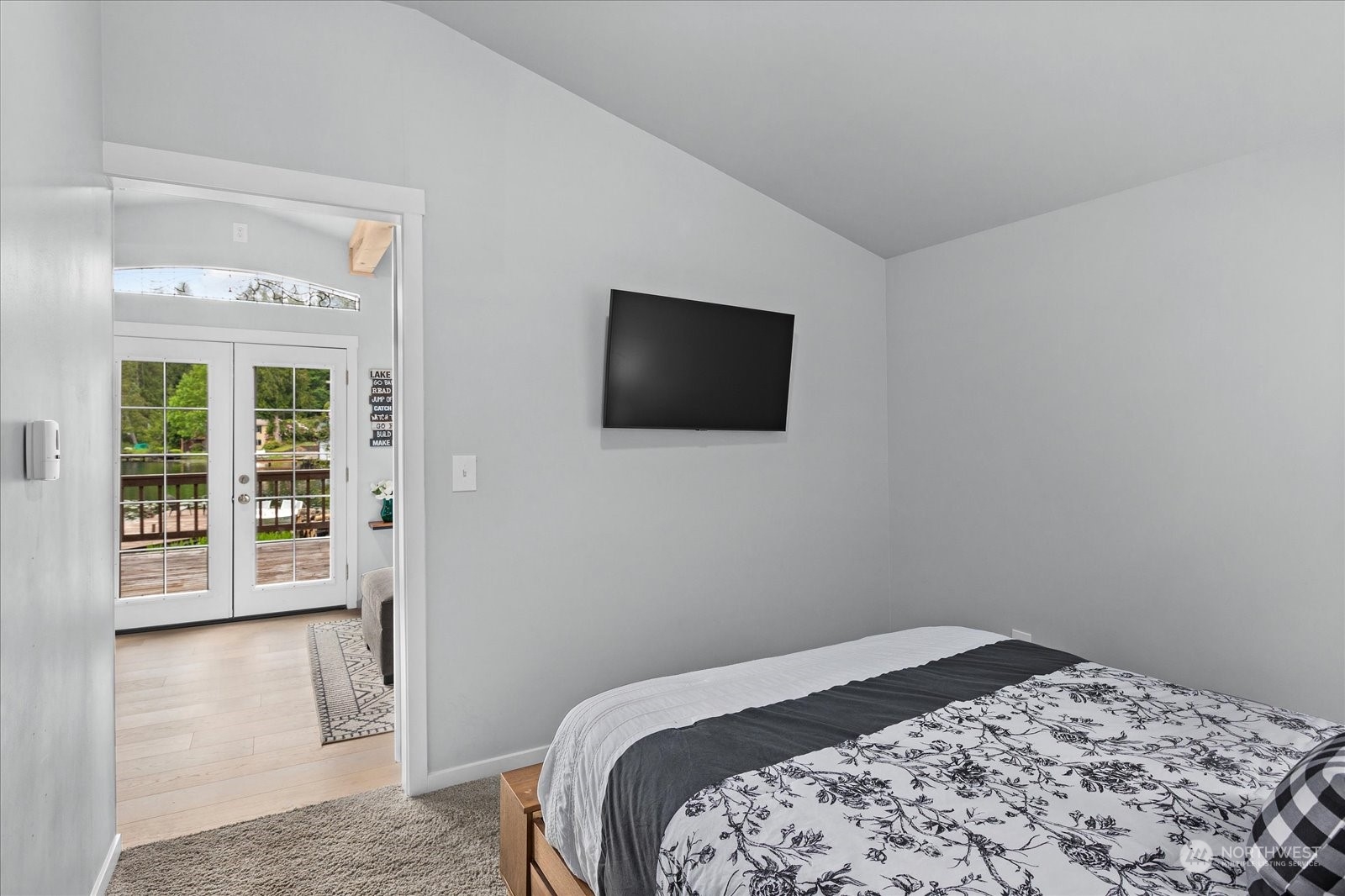 1024 South Lake Roesiger Road Snohomish, WA 98290 - Photo 18 of 35 a bedroom with a bed and a flat screen tv