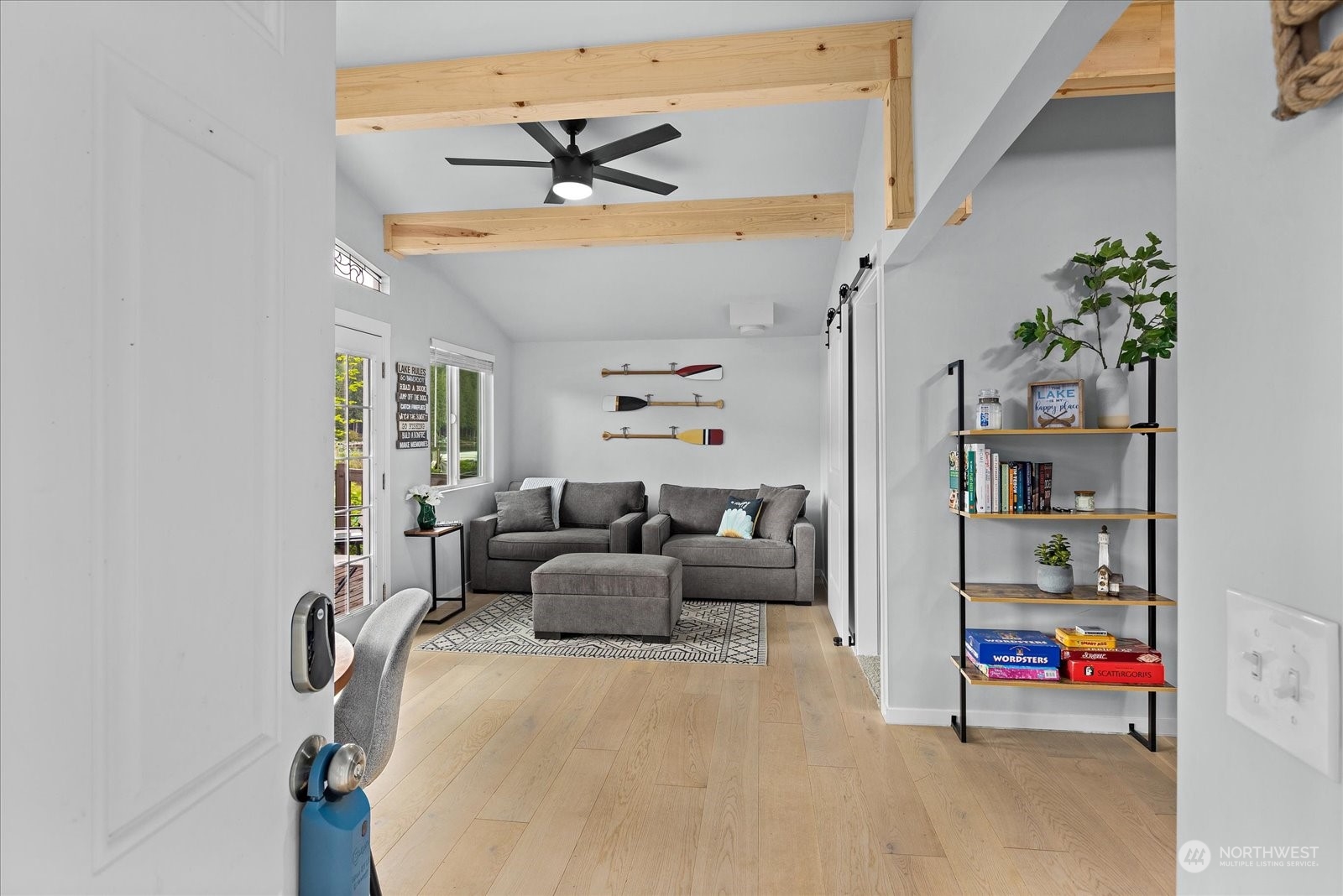 1024 South Lake Roesiger Road Snohomish, WA 98290 - Photo 6 of 35 a living room with furniture and a chandelier