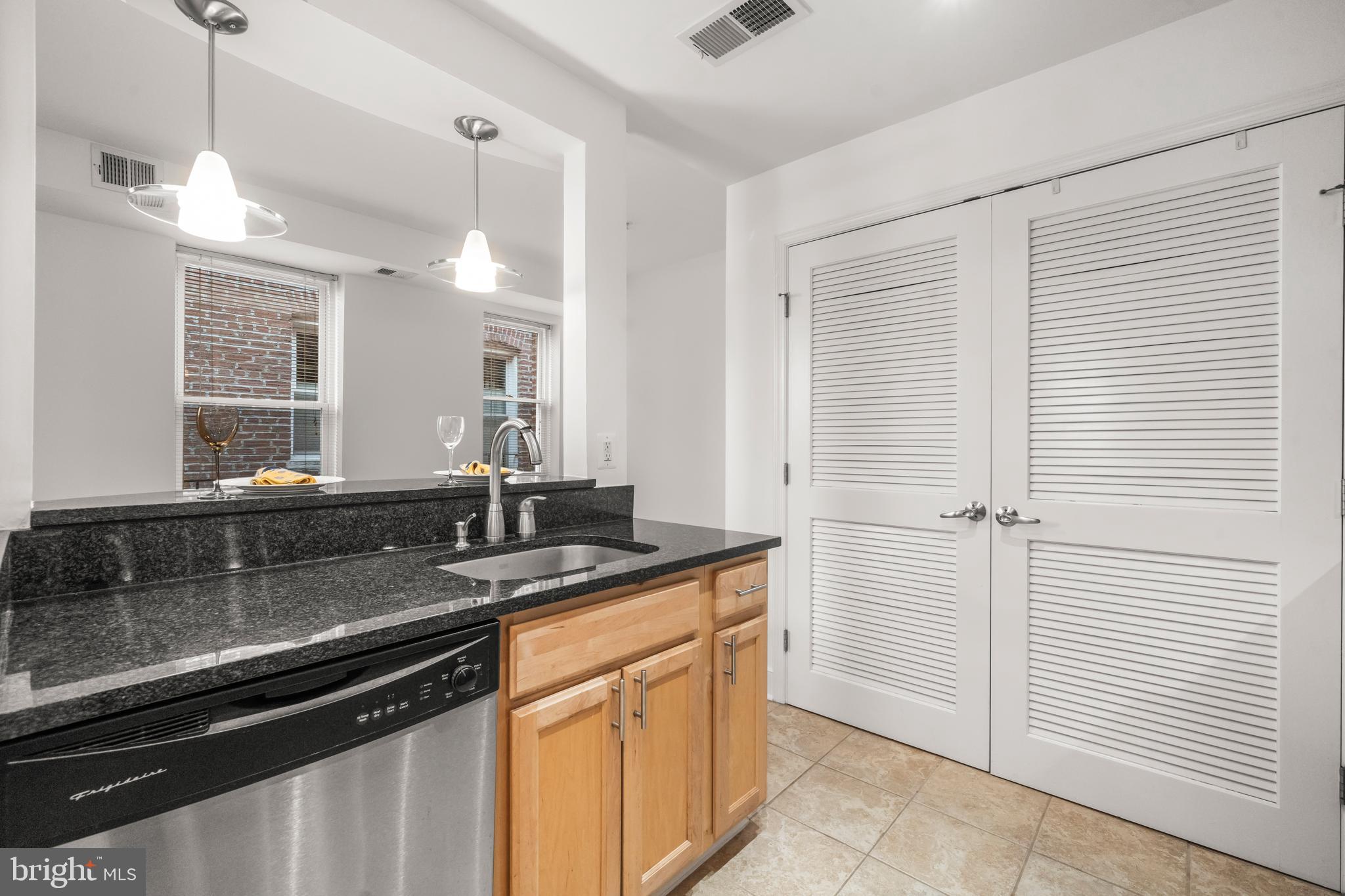1106 Columbia Road Northwest, Unit 304 Washington, DC 20009 - Photo 11 of 25 a kitchen with a sink and cabinets