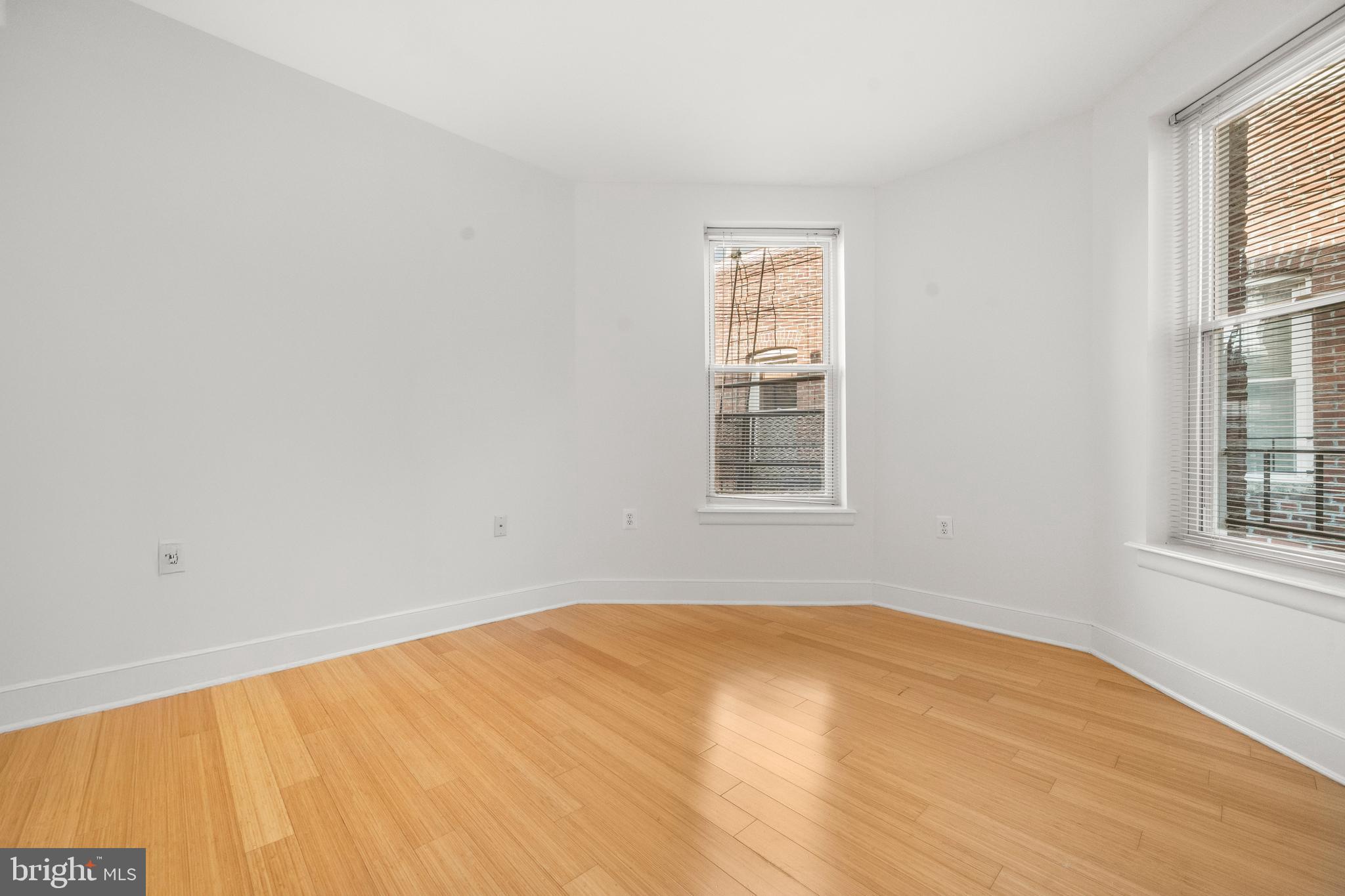 1106 Columbia Road Northwest, Unit 304 Washington, DC 20009 - Photo 14 of 25 an empty room with a window