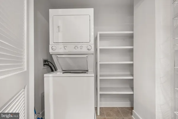 a view of storage and utility room with washer and dryer
