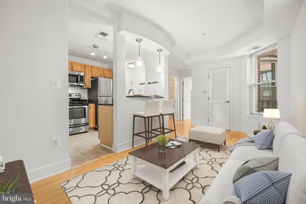 a living room with furniture and a table