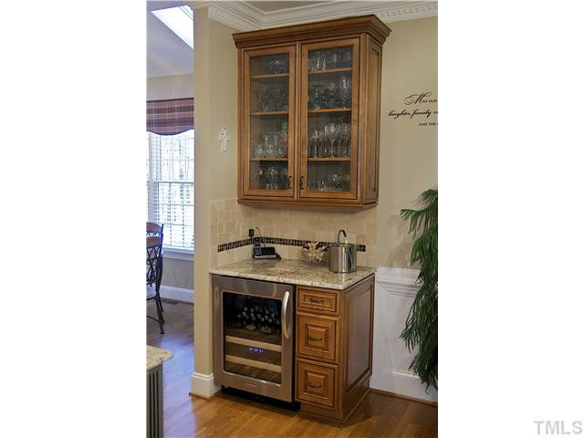 9321 Stone Mountain Road Raleigh, NC 27613 - Photo 5 of 25 Textured glass cabinet, and separate beverage refrigerator. Kitchen