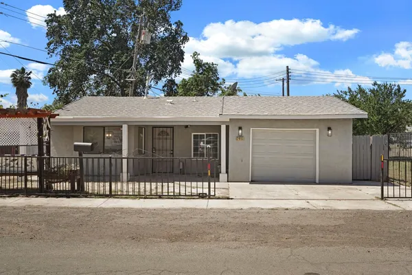 a front view of a house with a garage