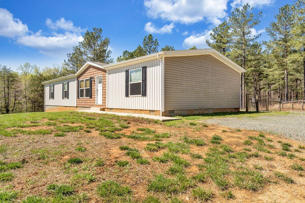 780 Adkins Road Penhook, VA 24137 - Photo 24 of 49 a house with yard in front of it