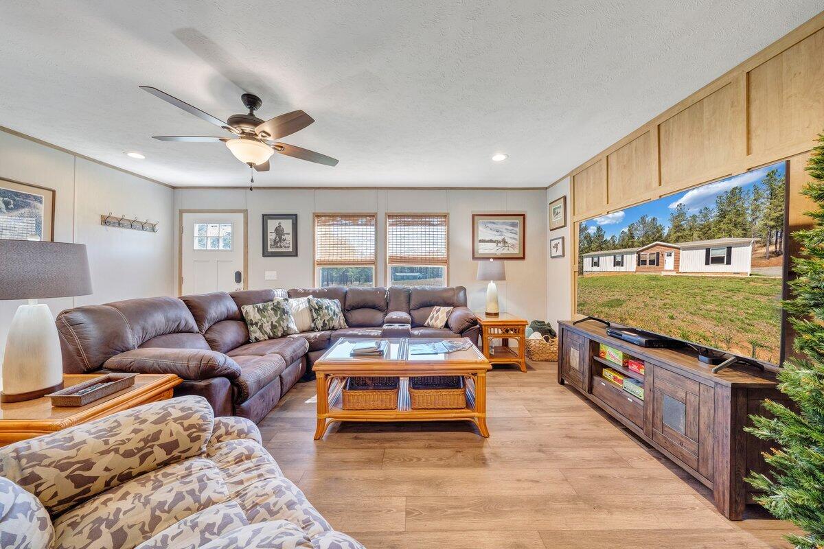 780 Adkins Road Penhook, VA 24137 - Photo 25 of 49 a living room with furniture and a large window