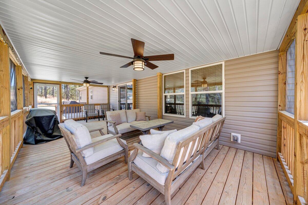 780 Adkins Road Penhook, VA 24137 - Photo 2 of 49 a spacious bedroom with a bed and a large window