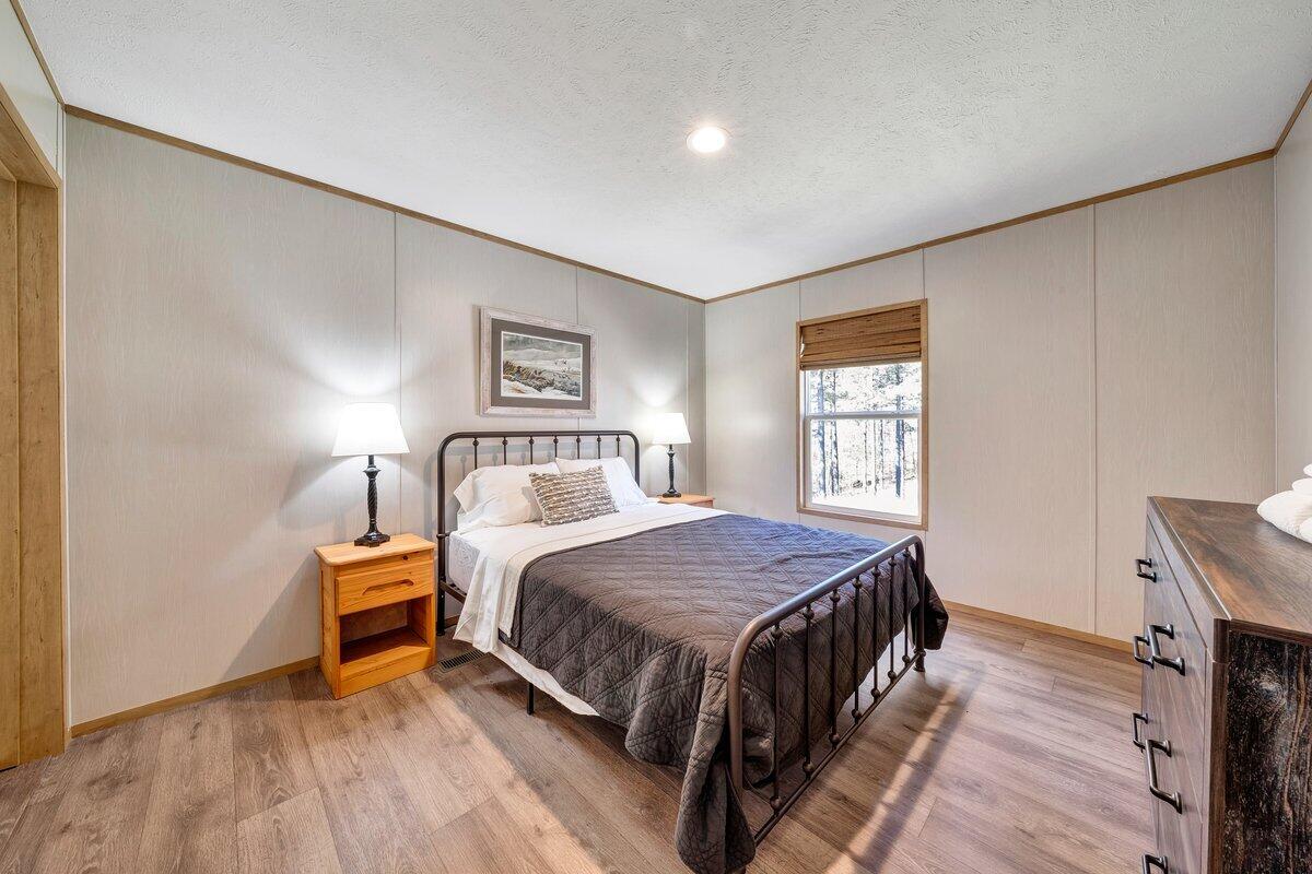 780 Adkins Road Penhook, VA 24137 - Photo 29 of 49 a bedroom with a bed and a window